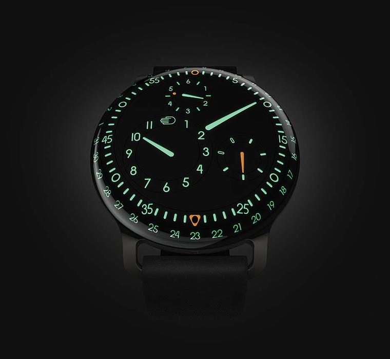 The new Ressence Type 3 watch lights up like the cockpit of an airplane at night with green and orange luminescence.
