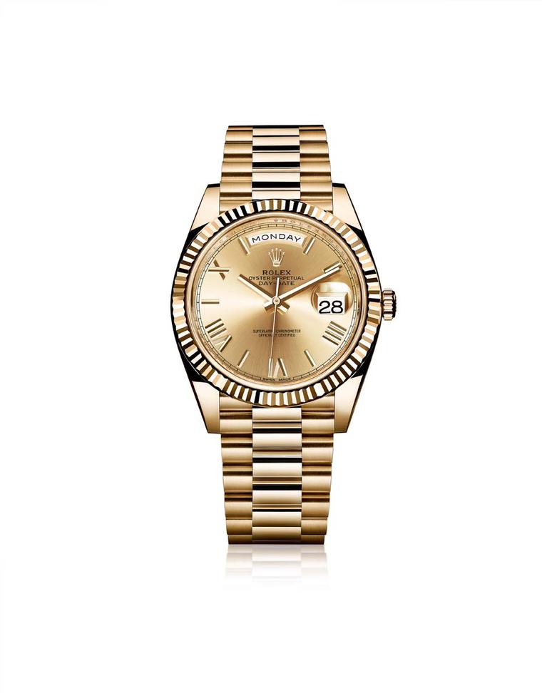 Rolex Oyster Perpetual Day-Date men's watch in a 40mm yellow gold case with the iconic date and day of the week indications, lovely champagne sunray finish gold dial and bevelled Roman numerals.