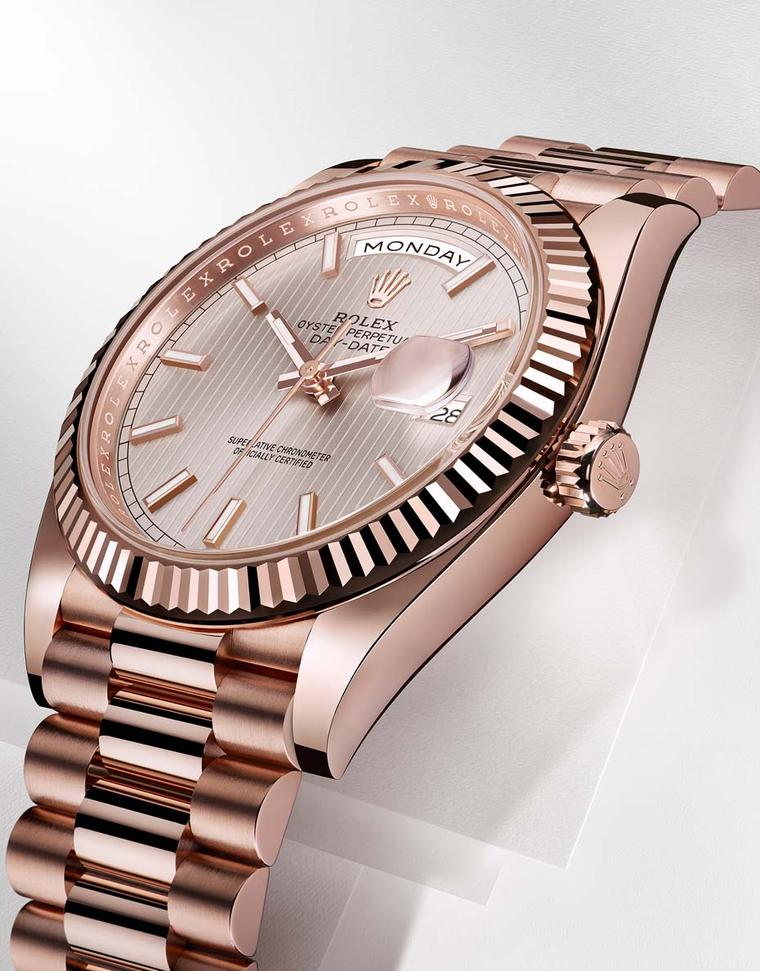 Rolex Oyster Perpetual Day-Date 40mm men's watch with an Everose gold dial with sunburst striped motifs on the dial, a three-piece solid gold link President bracelet and new 3255 Manufacture Rolex calibre.