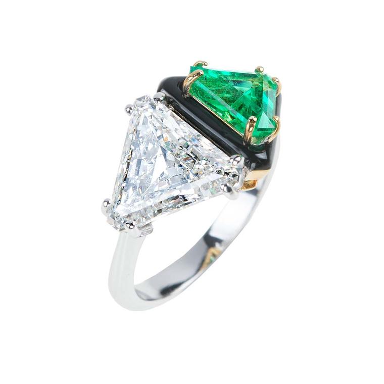 A triangle-cut diamond and emerald, divided by a line of black enamel, give this Nikos Koulis unique engagement ring an Art Deco feel.