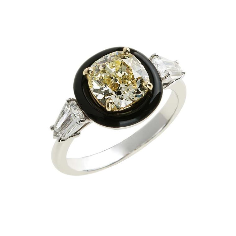Nikos Koulis fine jewellery diamond engagement ring in white gold, set with a central yellow diamond encircled by a halo black enamel, with baguette diamond shoulders.