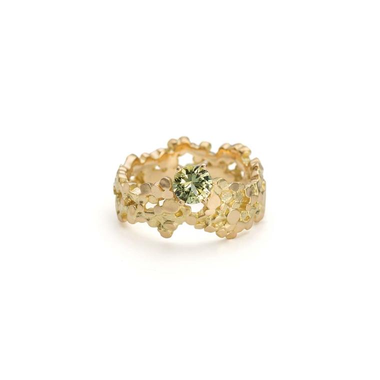 Mirri Damer engagement ring in gold set with a single green sapphire inspired by the stormy seas of Cornwall.