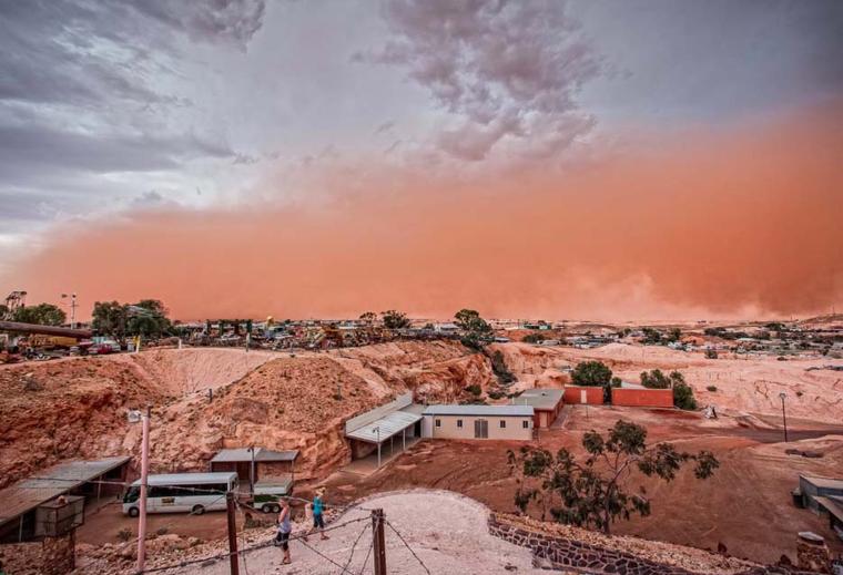 The view of a dust storm from Umoona, Coober Pedy - an underground walk-in mine, tourist accommodation and shop, leased from the indigenous owners of the area. Photo: Courtesy of South Cape Photography / District Council of Coober Pedy.