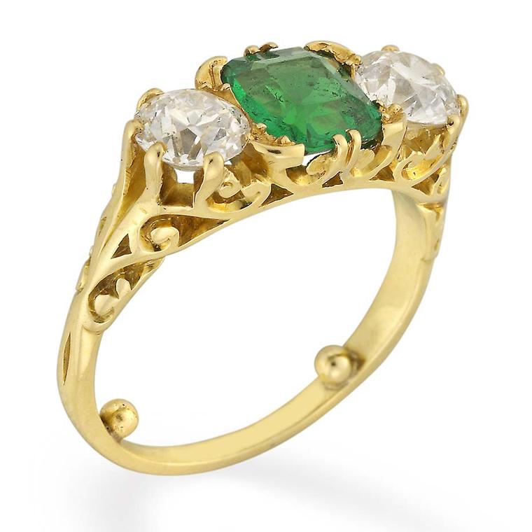 A side view of the Bentley & Skinner emerald and diamond Victorian engagement ring, circa 1880.