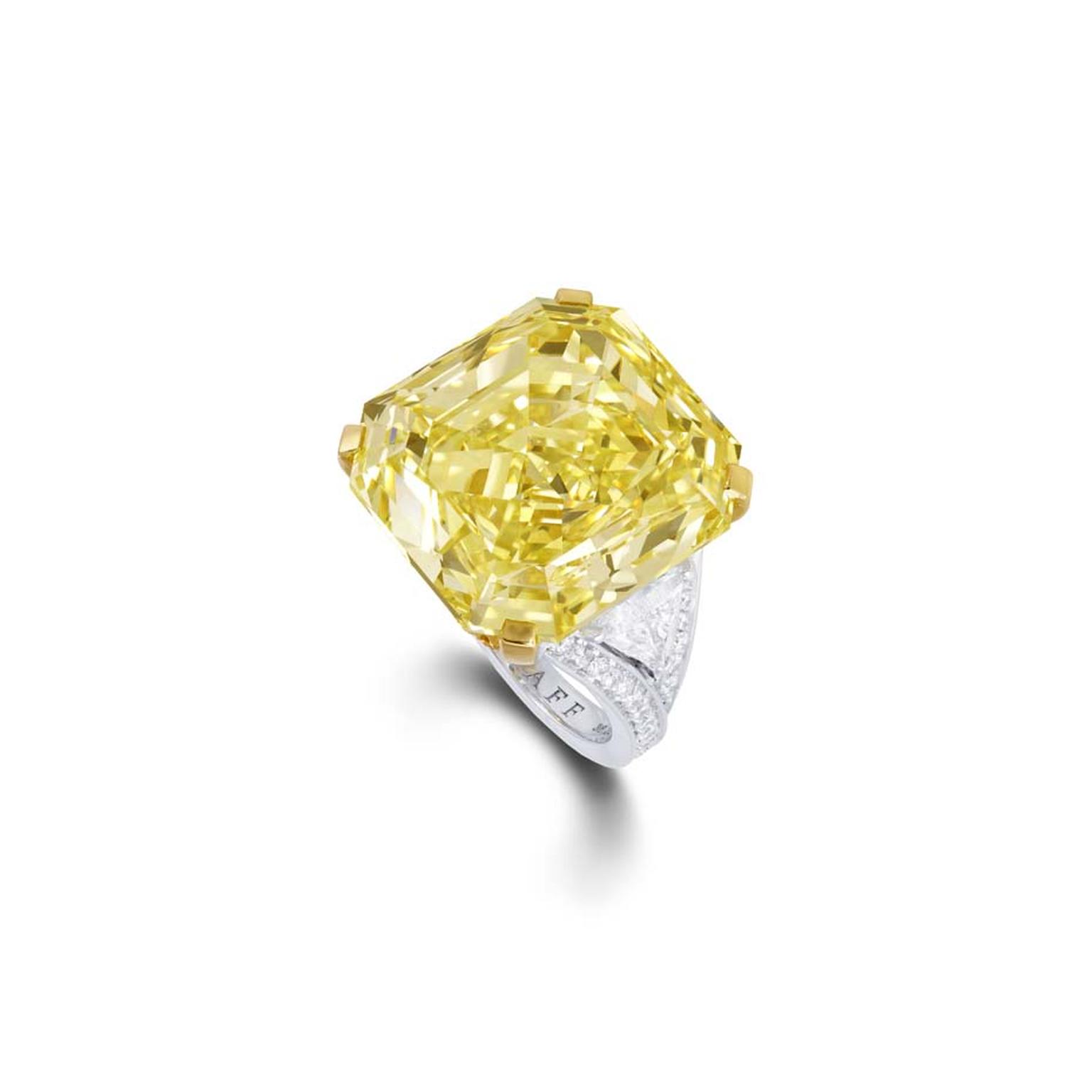 A striking 36.23ct emerald-cut Fancy Intense yellow diamond ring from Graff with brilliant diamond shoulders, set in platinum.