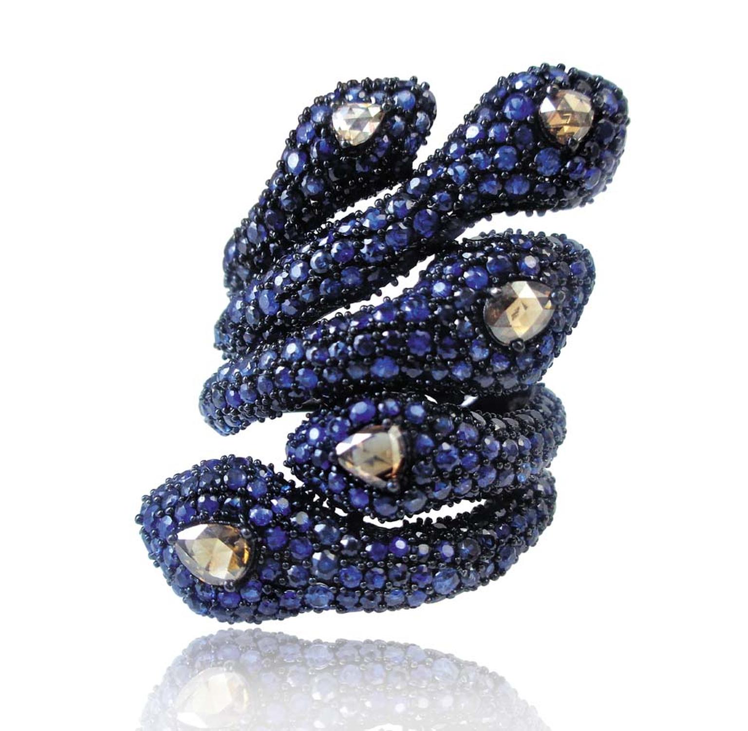 Sutra snake ring in black gold with 5ct of sapphires and diamonds.