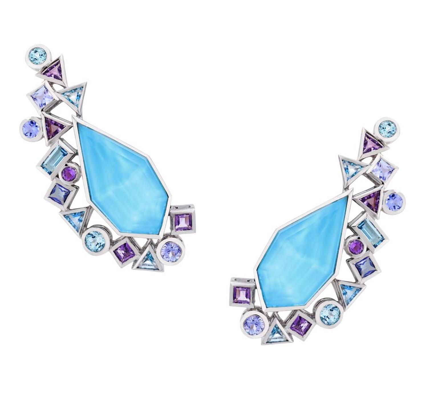 Stephen Webster earrings from the new Gold Struck collection, featuring a central sky-blue facetted crystal with bezel-set blue and mauve stones.