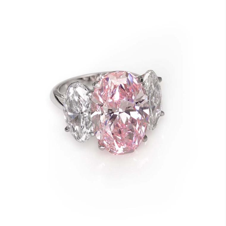 David Morris 10.11ct fancy pink flawless oval diamond ring, mounted in platinum, with 2ct each oval diamond shoulder stones.