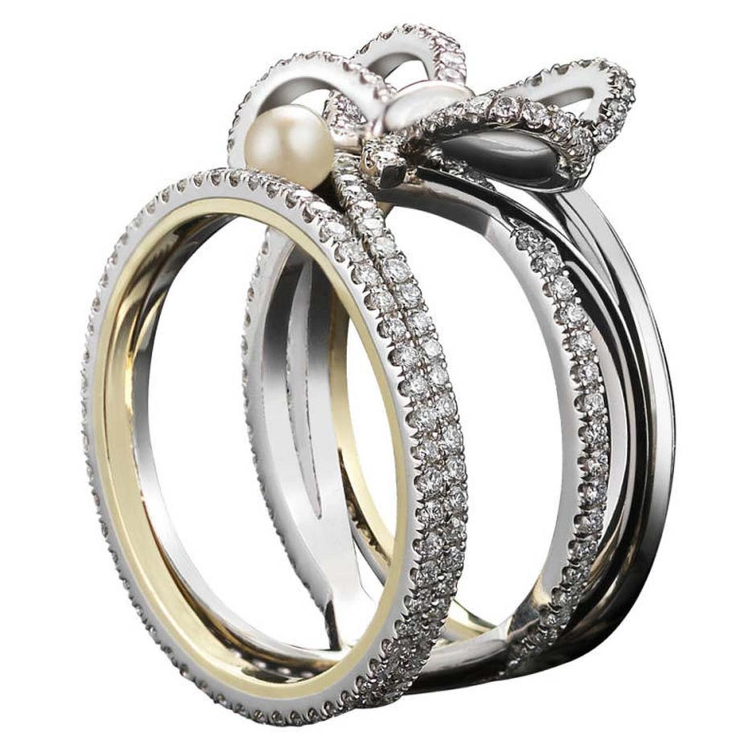 Contemporary Diamond Bow and Pearl ring by Alexandra Mor with the designer's signature 1mm knife-edged wire, set in platinum around inner bands of 18ct yellow gold.