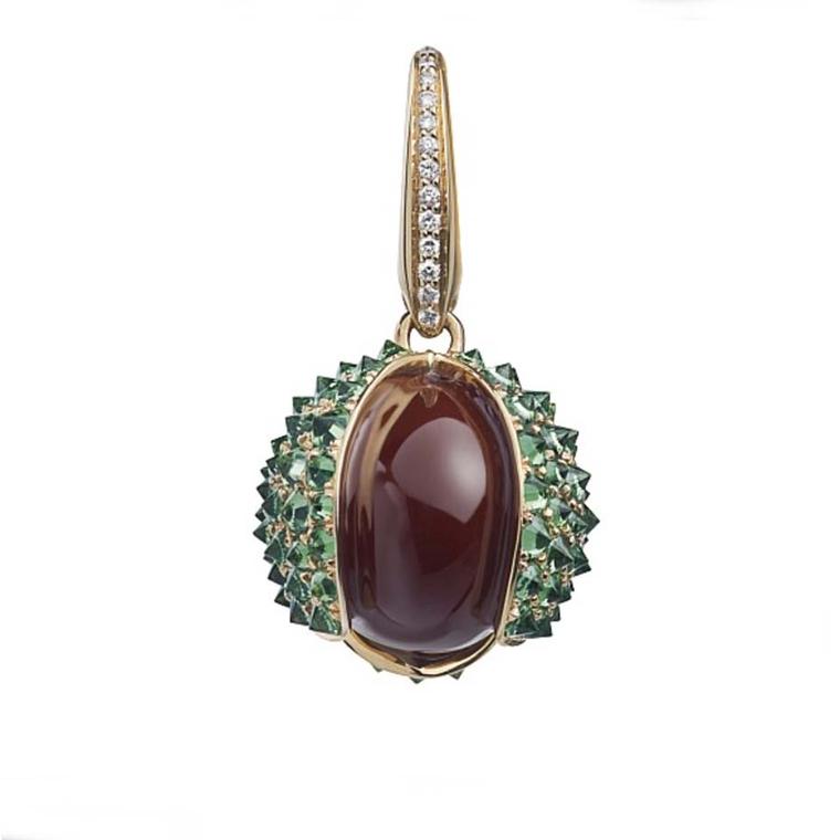 Asprey Conker charm with pavé diamonds and green tsavorites, set in yellow gold. Can be worn on a bracelet or necklace (£3,200).