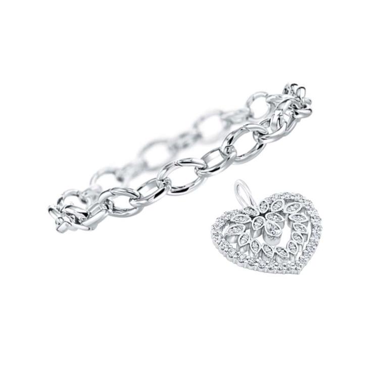 Harry Winston platinum link bracelet and diamond cluster heart, with 60 pear-shaped and round brilliant diamonds set in platinum.
