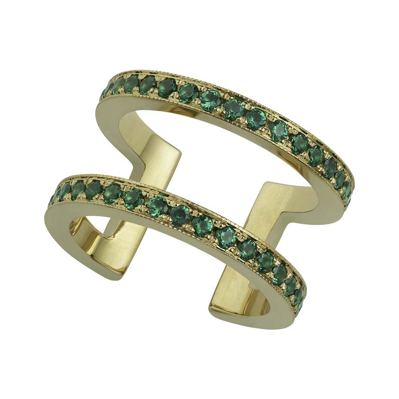 Misahara Korali statement ring has a thicker yellow gold band, set with emeralds.
