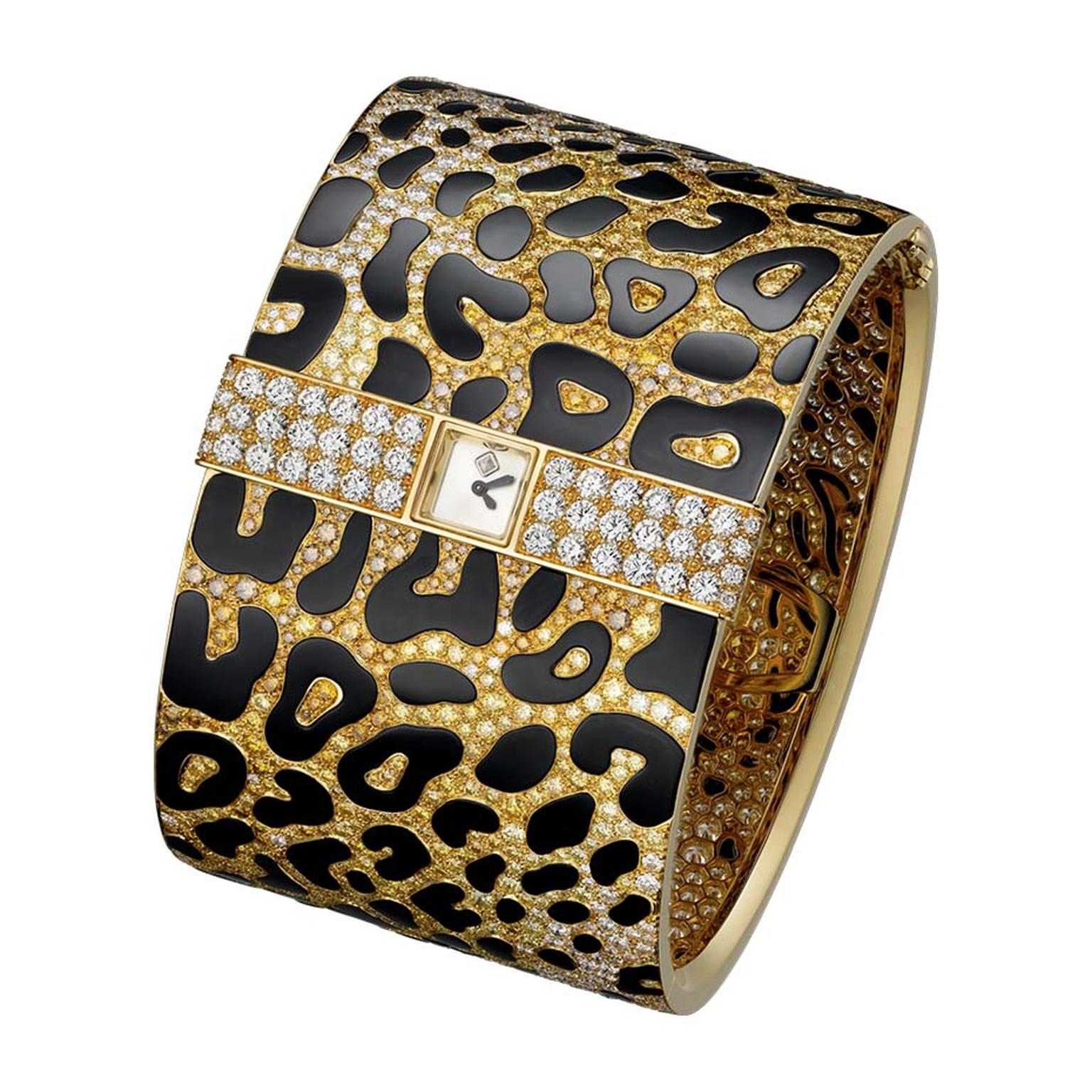 Cartier's Panthère Impériale high jewellery cuff is pavéd with light yellow, light orange, deep orange and brown brilliant-cut diamonds to create the panther's sumptuous coat. The secret watch is diminutive - no larger than the panther's eye - and discree