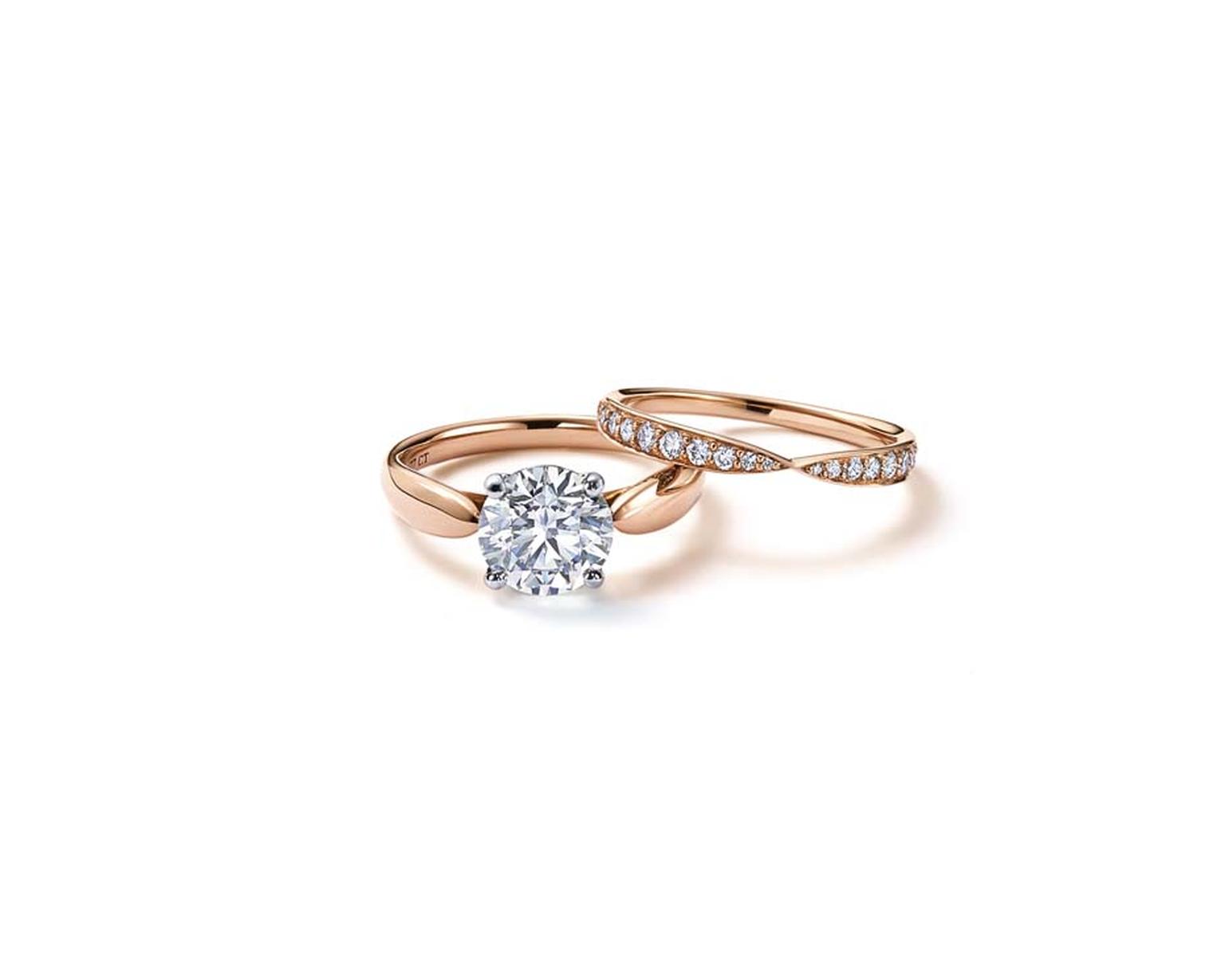 Tiffany Harmony™ solitaire diamond engagement ring in rose gold, with a matching rose gold wedding band with diamonds.