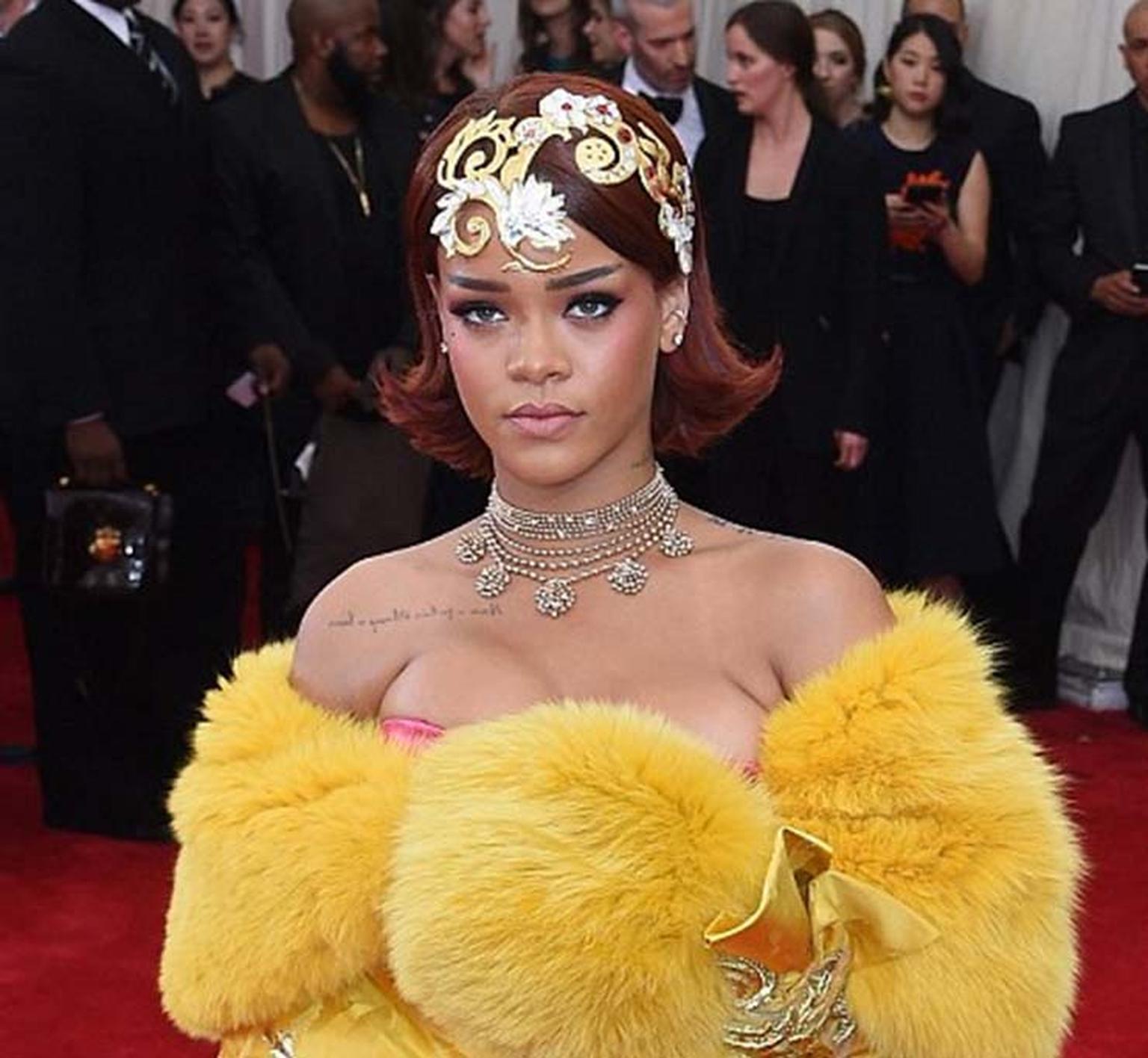 Rihanna made the entrance of the night at this year's Met Gala, accessorizing her show-stopping couture gown - designed by Guo Pei, whose work features in the exhibition - with a golden headpiece and Cartier Paris Nouvelle Vague necklace.