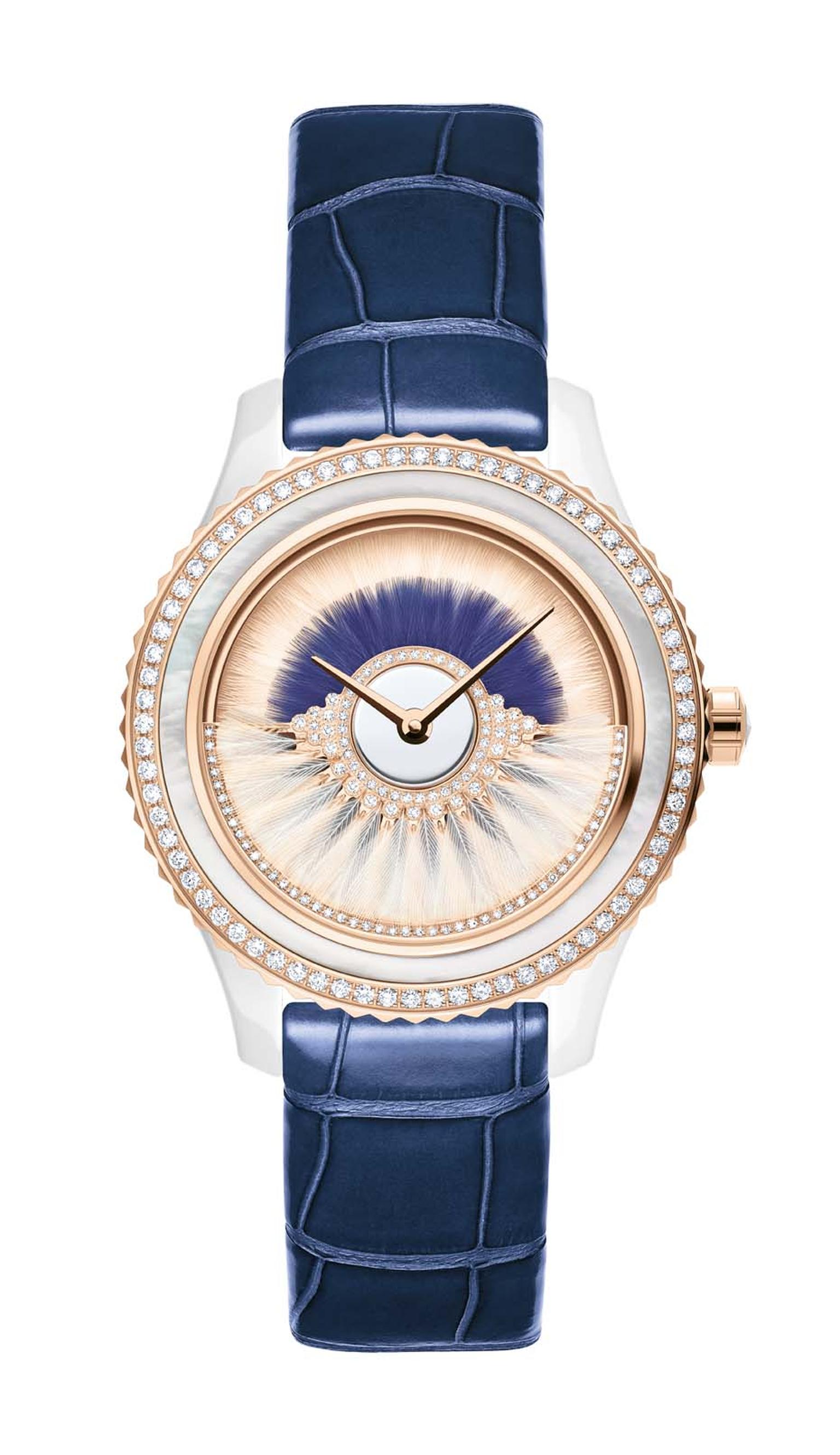 Dior VIII Grand Bal Cancan watch in a 38mm pink gold and ceramic case has a dial decorated with two rows of white and blue feather marquetry. The pink oscillating weight on the dial swings back and forwards and is set with diamonds and white feathers. Lim