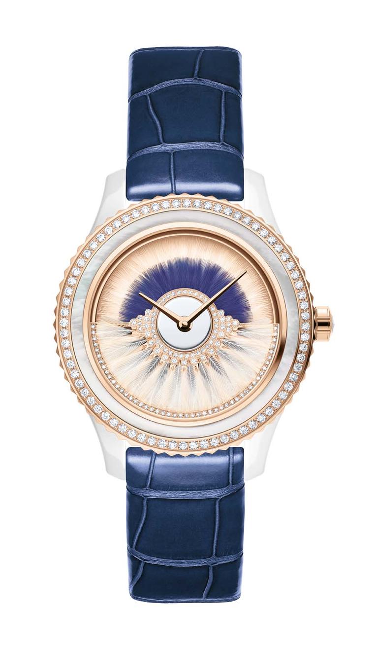 Dior VIII Grand Bal Cancan watch in a 38mm pink gold and ceramic case has a dial decorated with two rows of white and blue feather marquetry. The pink oscillating weight on the dial swings back and forwards and is set with diamonds and white feathers. Lim