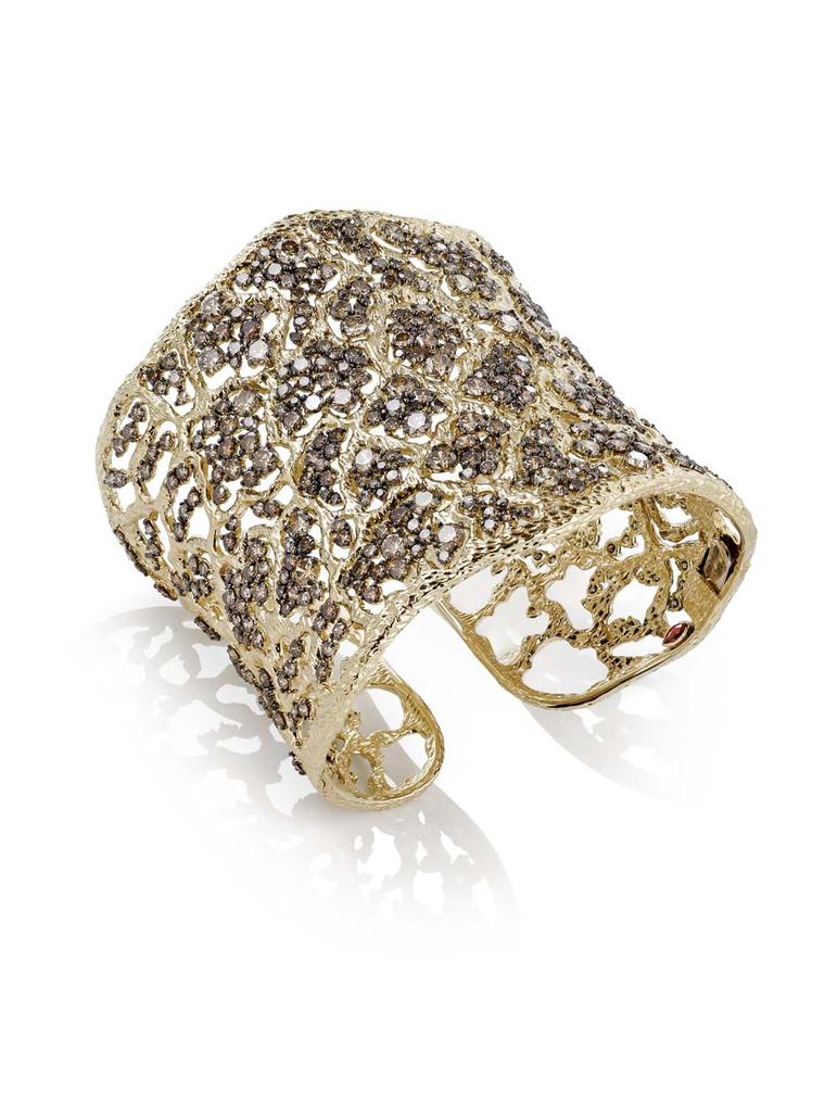 Roberto Coin's dazzling Tanaquilla cuff draws the eye with textured gold and brown diamonds inspired by the intricate detail of ancient Etruscan jewelry.