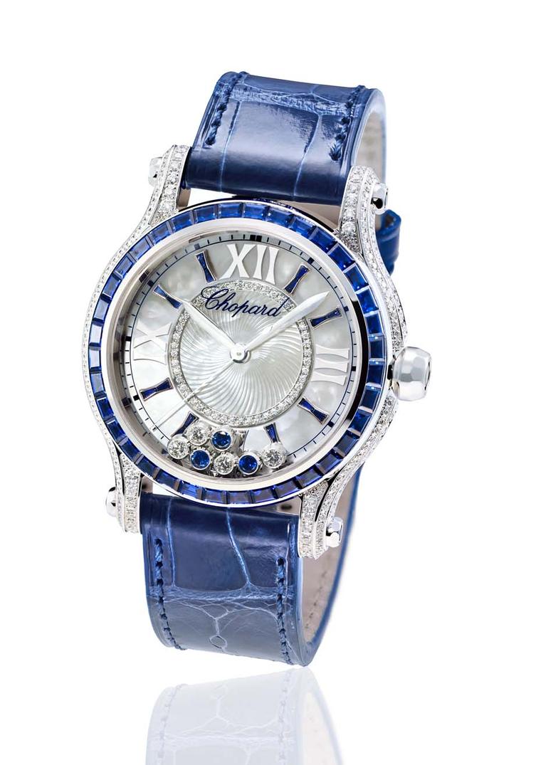 Chopard watches Happy Sport Medium Automatic Joaillerie dresses up with blue baguette-cut sapphires on the bezel and indices, and three free-floating sapphires on the dial to accompany the four dancing diamonds.