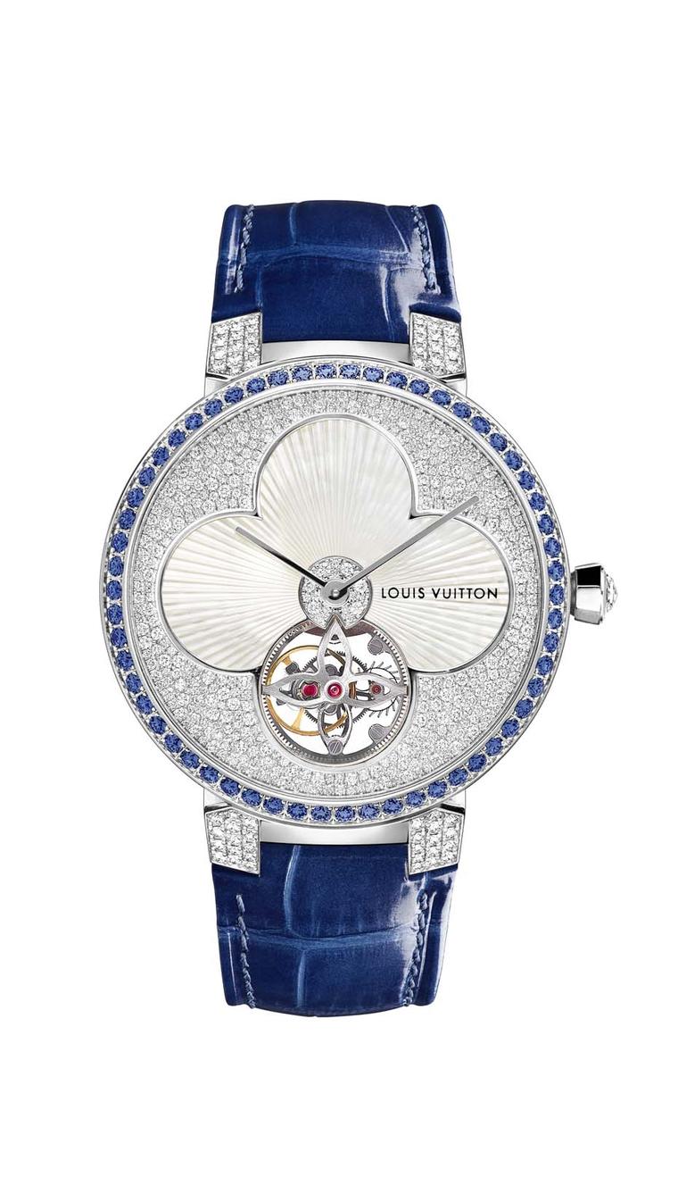 Louis Vuitton watches Tambour Monograph Sun Tourbillon marries its symbolic flower and star logos to the sophisticated mechanical show of a tourbillon. The white mother-of-pearl flower in the centre sits pretty in a bed of snow-set diamonds framed by 58 b