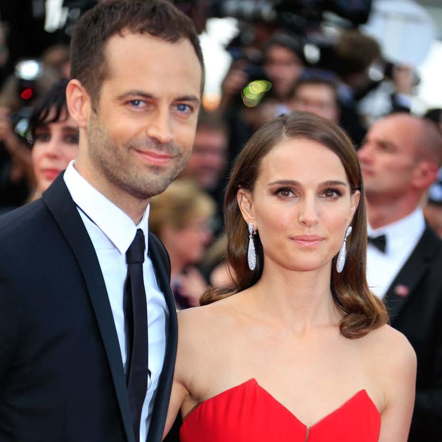 Natalie Portman pictured alongside her husband, Benjamin Millepied, wearing teardrop-shaped diamond Gocce earrings by de GRISOGONO.