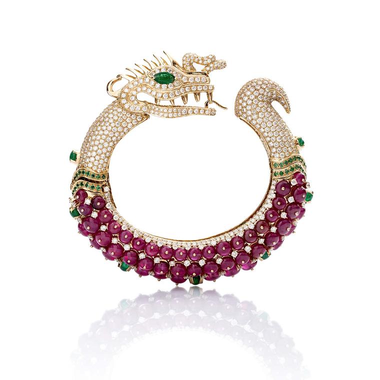A magnificent Farah Khan ruby cuff shaped like a dragon in yellow gold with emeralds and diamonds, from the new Le Jardin Exotique collection.