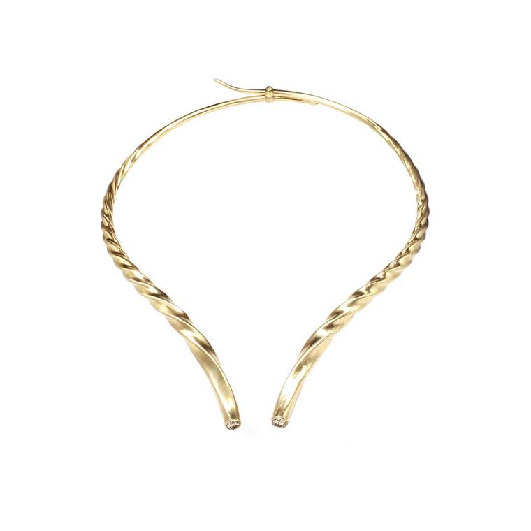 Marc Alary hinged gazelle double horns necklace in yellow gold, set with two champagne diamonds.