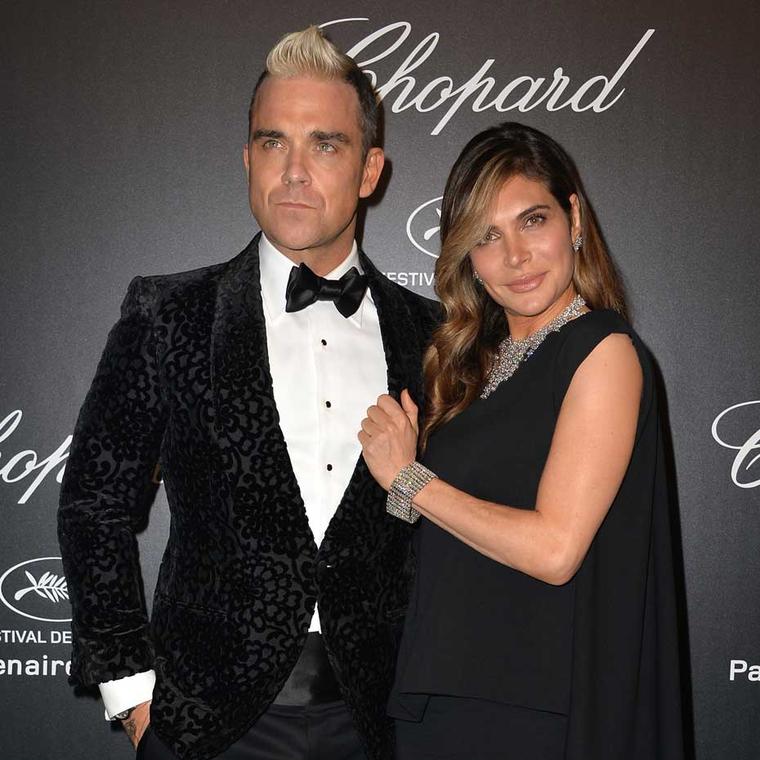 Robbie Williams attended Chopard's GOLD party in Cannes on Monday evening, where he was the star attraction, performing a special concert for A-list guests. His wife Ayda accompanied him accessorised in Chopard diamonds.