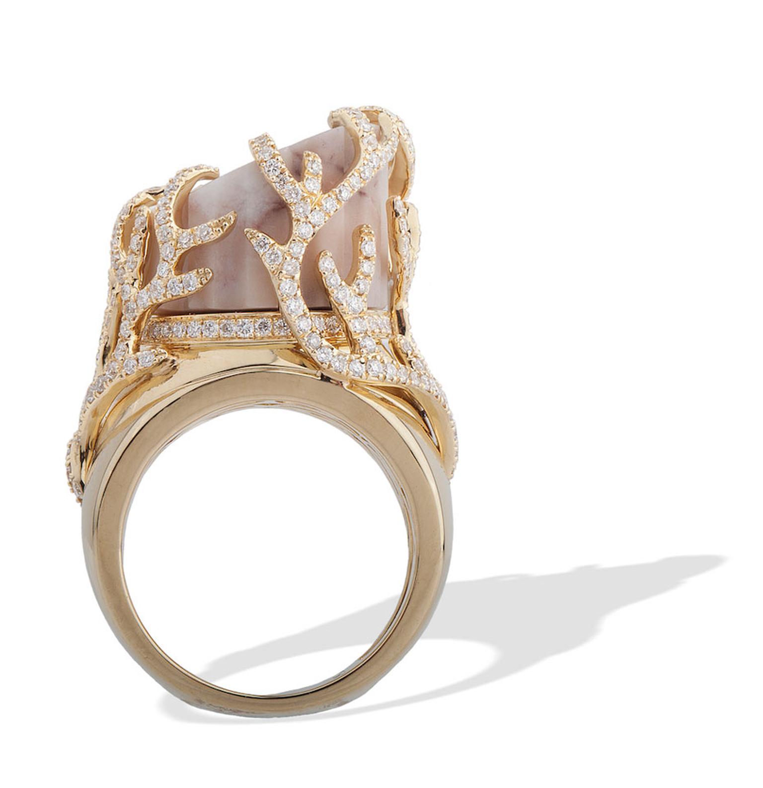 This CompletedWorks Incomplete Column gold ring is set with column-shaped marble from Massa, Italy. The base of the column is surrounded by circular-cut diamonds.