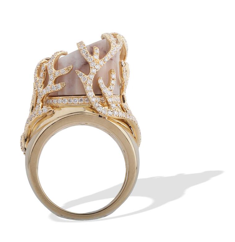 This CompletedWorks Incomplete Column gold ring is set with column-shaped marble from Massa, Italy. The base of the column is surrounded by circular-cut diamonds.