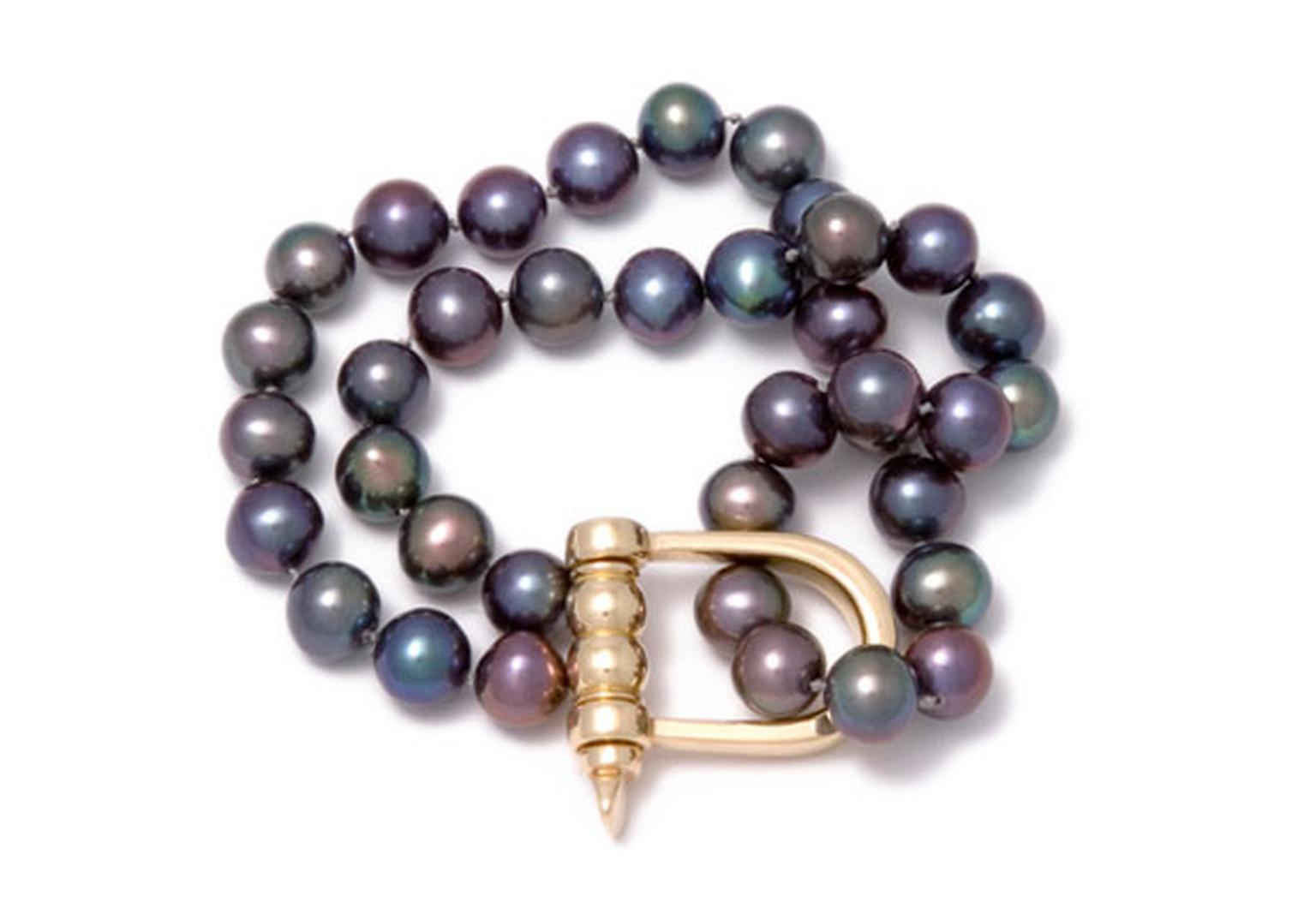 Gold shackle and double strand of Tahitian pearl bracelet