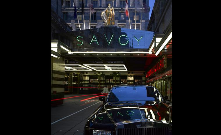 The forecourt of the refurbished Savoy Hotel in London with its iconic neon sign