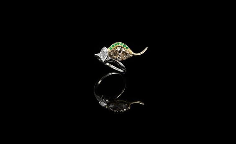 Jessica McCormack, Envy ring, yellow and white gold, set with a marquise-shaped diamond held by yellow gold ‘lashes’ highlighted by pave set emeralds £26,000