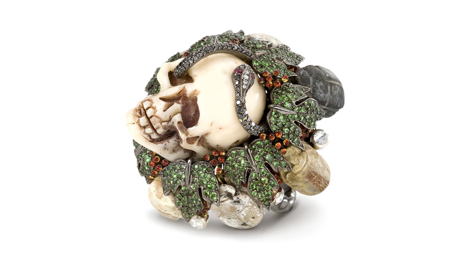 Lydia Courteille, The Skull head ring is in blackened gold, green garnets, black diamonds, antique amulets POA