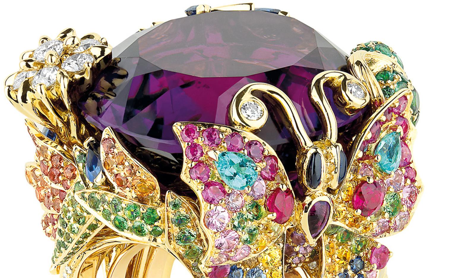 Close up of the Dior 'Incroyables et Merveilleuses' Papillon de Paradis ring. Look at the butterfly on resplendant in sapphires, pink, orange and yellow sapphires and the flash of swimming-pool blue Paraiba tourmalines