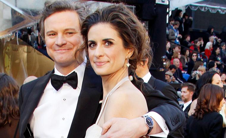 A proud Colin Firth embraces his wife Livia Giuggioli showing to advantage his Chopard L.U.C. XPS white gold watch