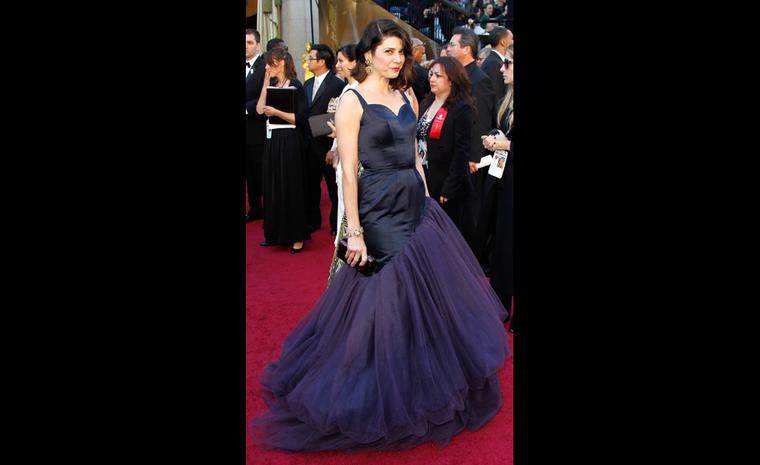 Marisa Tomei in her spectacular Charles James gown set off by 1960 yellow and blue sapphire, emerald and diamond earrings and bracelet made for a private client by Van Cleef & Arpels, New York.