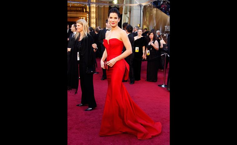 Sandra Bullock wearing Harry Winston emerald-cut diamond earstuds, 5.5 carats each, vintage diamond bead bracelets