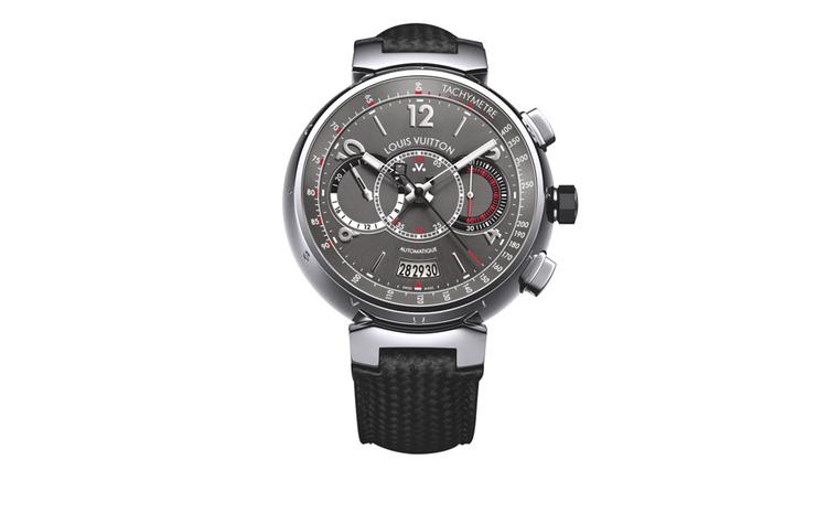 VUITTON, Voyagez Tambour Automatic Chronograph watch with a tachymeter. Set in a 44mm wide Tambour style case, the Voyagez is in steel with a gray and red dial with black and white trim. The dial design uses three middle aligned subdials for the...