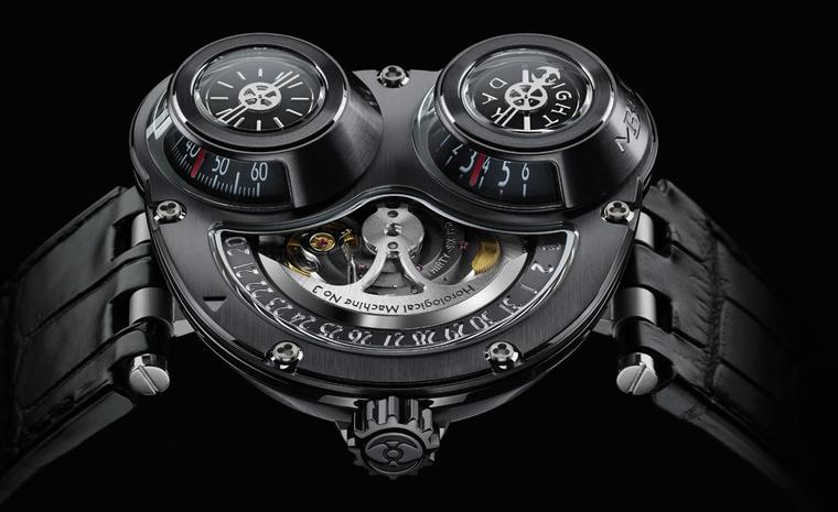 MB&F's ReBel is designed to be worn on the right wrist and the case is white gold with a black PVD coating. Time is read off the two cones under the bulging glass domes.