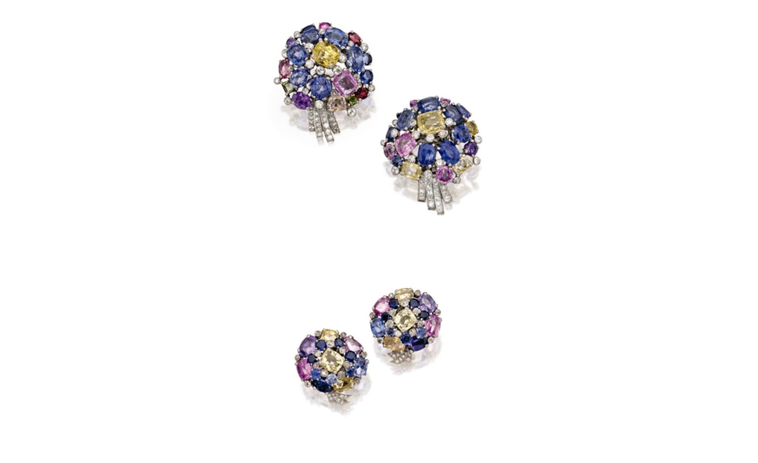 Lot 369 Pair of Platinum, Multi-colored Sapphire and Diamond Flower Clip-Brooches, Cartier, London, Circa 1940 Est. $20/30,000 and Lot 370 Pair of Platinum, Multi-colored Sapphire and Diamond Flower Earclips, Cartier, London, Circa 1940 Est. $12...