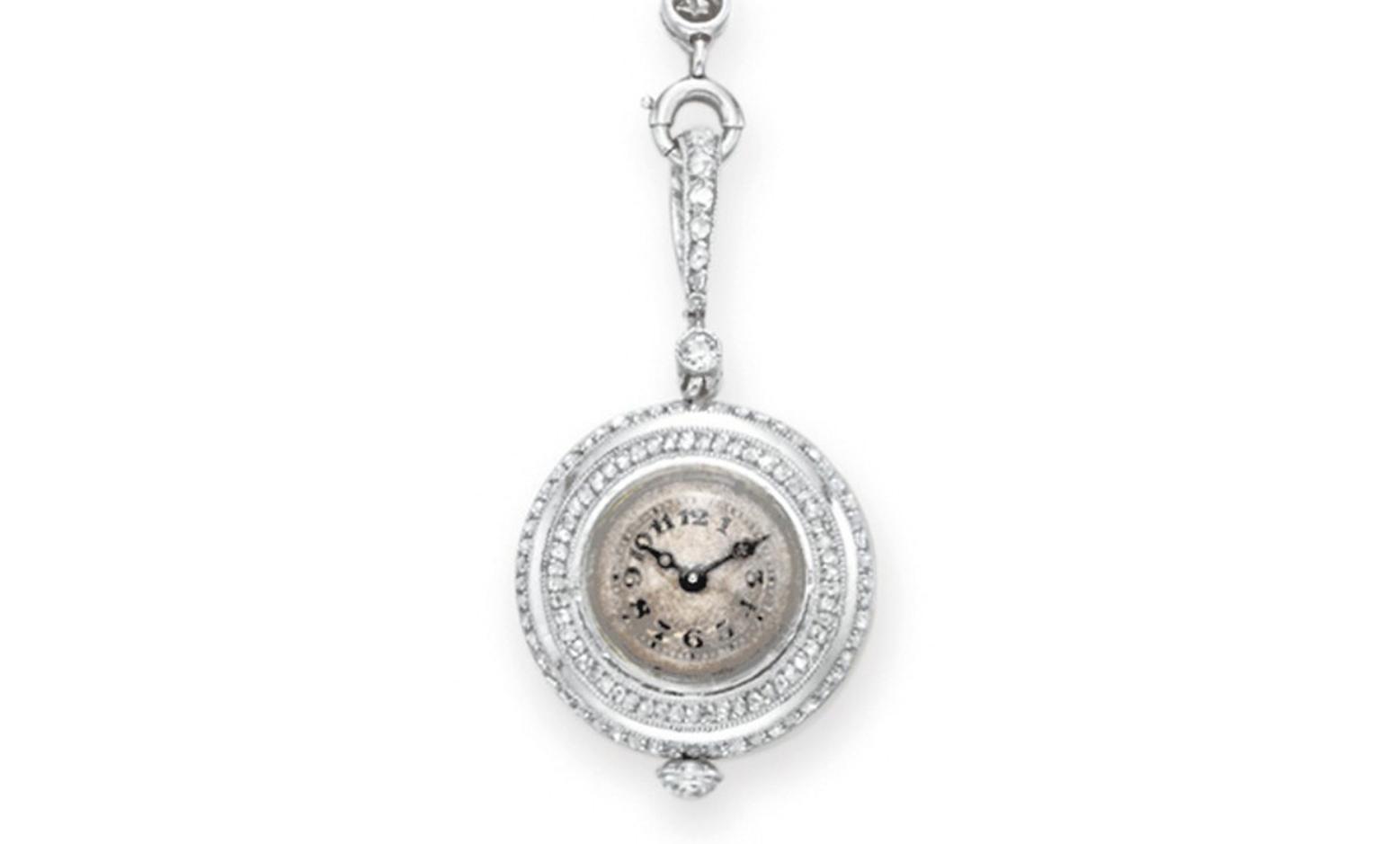 LOT 142 A BELLE EPOQUE PEARL AND DIAMOND PENDANT WATCH NECKLACE S circa 1910, 19 ins., with French assay marks Estimate $15,000-$20,000