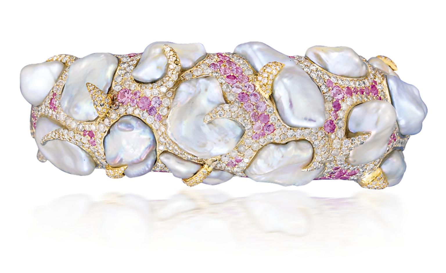 Lot 92. An attractive cultured pearl, coloured sapphire and diamond bangle, by Andre Marcha. Estimate 20,000 - 30,000 U.S. dollars