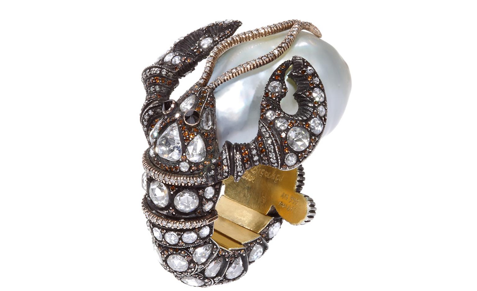 A lobster cradling a baroque pearl slips onto the finger in this Sevan Biçakçi ring.