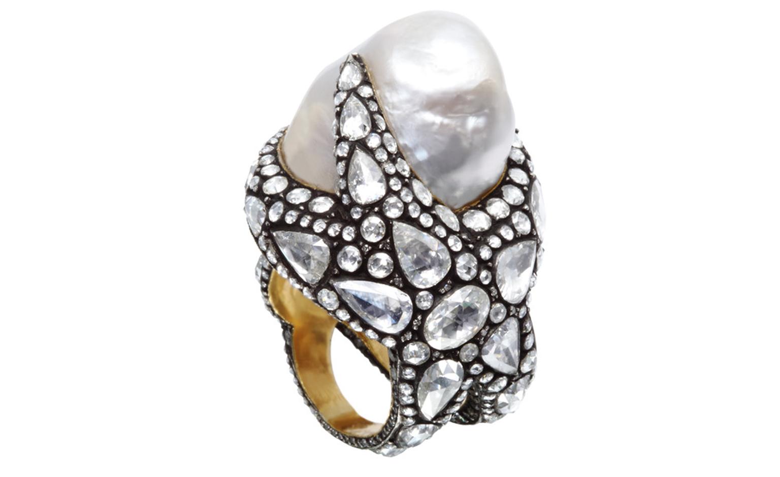 More marine inspiration in this Sevan Biçakçi ring that wraps a starfish around the finger topped by a gorgeous baroque pearl. Rose-cut diamonds stand out against the oxidised metal.
