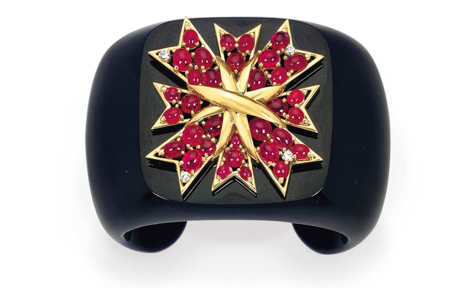 Lot 31. A diamond, ruby, onyx and gold cuff, by Verdura. Estimate 20,000 - 30,000 U.S. dollars. SOLD FOR $32,500