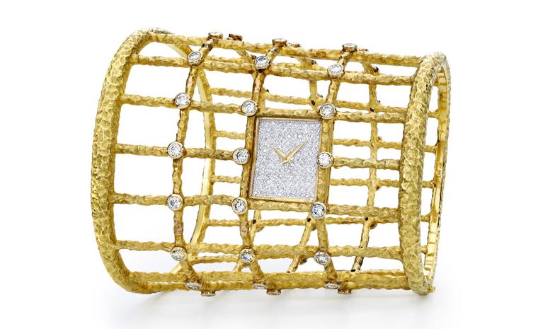 Piaget 1969 Cuff watch in yellow gold with diamond paved dial and 48 diamonds set on the cage-style bracelet.  Piaget ultra-thin hand wound 9P movement. Piaget Private Collection.
