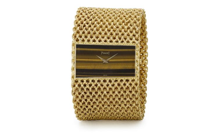 Piaget Cuff 1971 yellow gold cuff watch with tiger's eye dial and Piaget mechanical movement 9P. Piaget Private Collection.