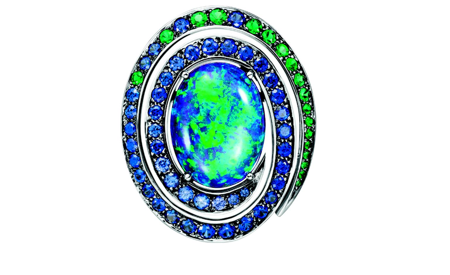 BOUCHERON. Aiguebelle earrings, set with an oval opal cabochon, paved with emeralds, blue and purple sapphires, on white gold. POA