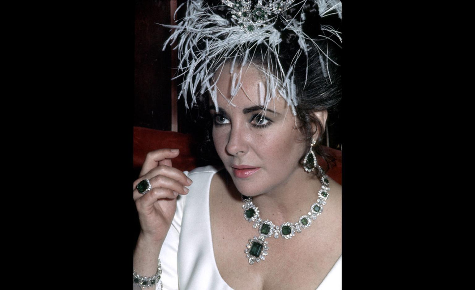 1965 – Elizabeth Taylor wearing Bulgari jewels: en tremblant brooch with diamonds and emeralds, an emeralds parure (gift of Richard Burton), credit, Getty Images.